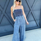 Mineral Washed Smocked Jumpsuit In Denim - Infinity Raine