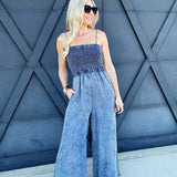 Mineral Washed Smocked Jumpsuit In Denim - Infinity Raine