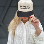 Put It On My Husbands Tab Trucker Hat - Infinity Raine