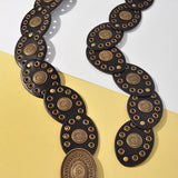 Floral Embossed Oval Disc Belt In Ago Black - Infinity Raine