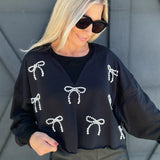 Cropped Pearl Bow Sweatshirt In Black - Infinity Raine