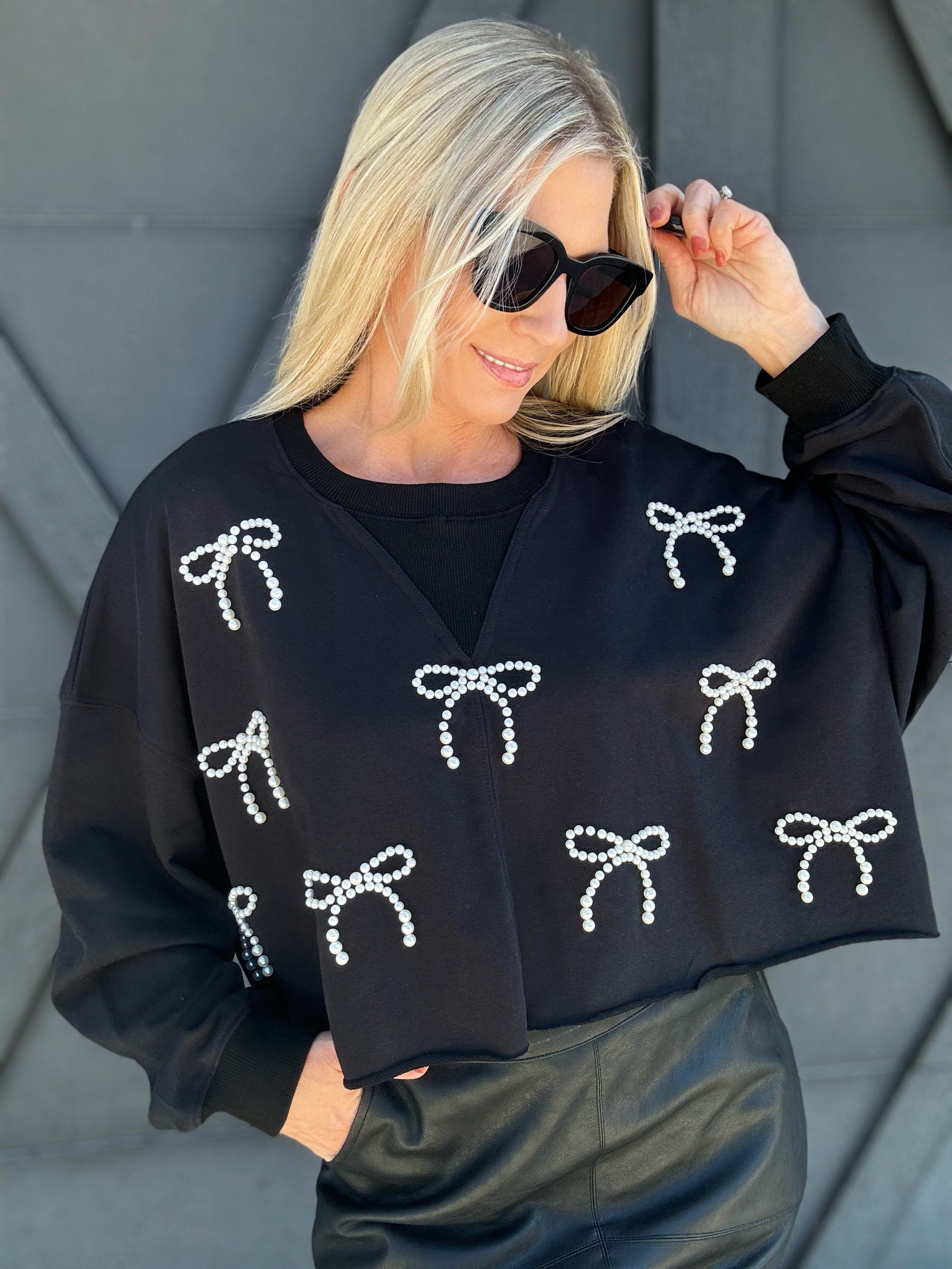 Cropped Pearl Bow Sweatshirt In Black - Infinity Raine